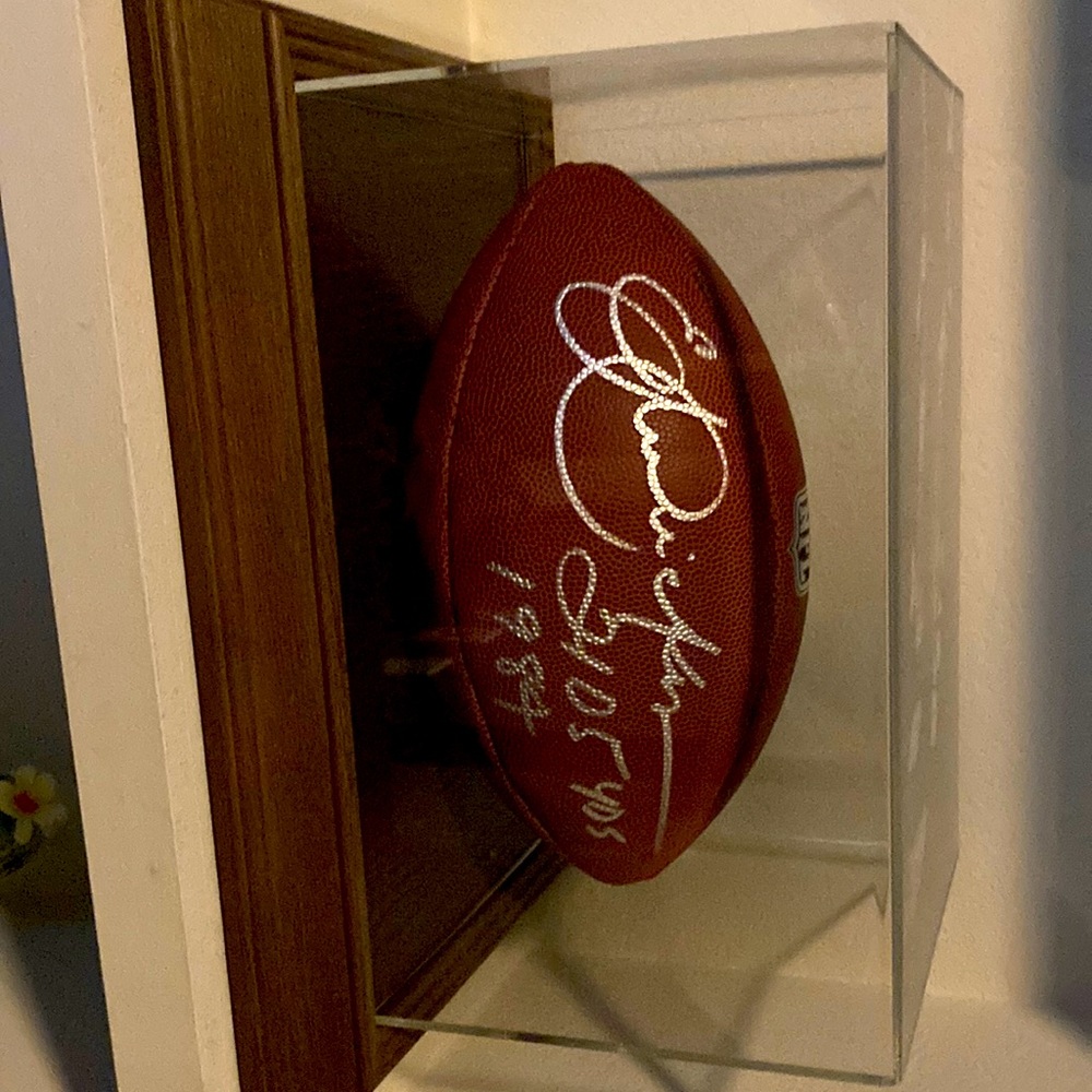 Eric Dickerson JSA auto NFL football.  Signed in silver sharpie 2105 Yds 1984